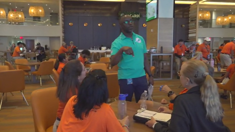 Miami Dade College professor finds his passion with side job at Hard Rock Stadium — CBS Miami, Pinecrest Arts news