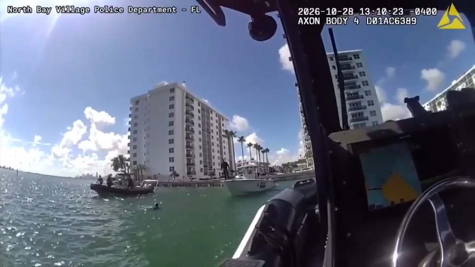 Body camera, drone video captures officers rescuing dolphin stuck in Biscayne Bay — Pinecrest Sports news